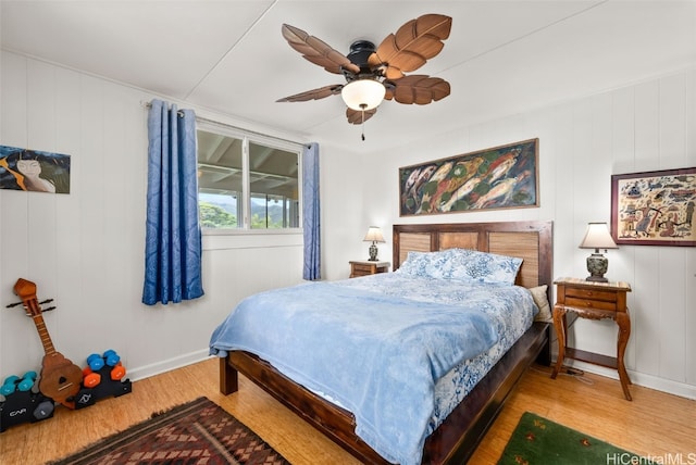 bedroom featuring wood-type flooring and ceiling fan