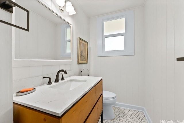 bathroom with tile patterned floors, vanity, and toilet