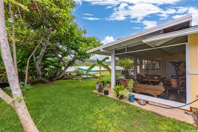 763 Kaipii St, Kailua, HI 96734 - view of green lawn featuring a sunroom