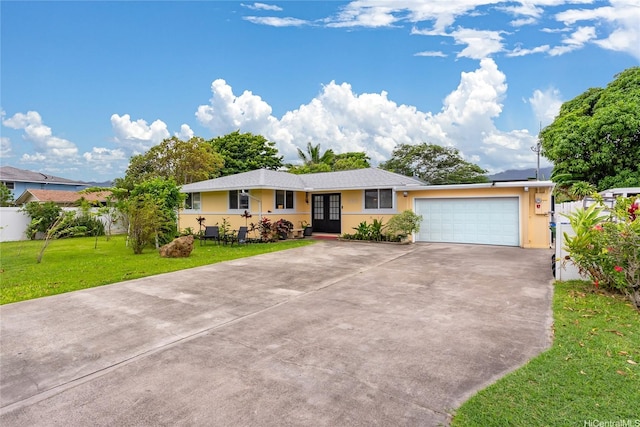 763 Kaipii St, Kailua, HI 96734 - ranch-style house featuring french doors, concrete driveway, a garage, and stucco siding
