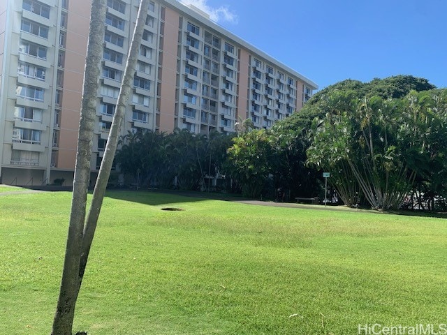 view of home's community with a lawn