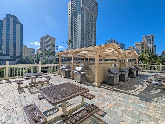 view of patio / terrace featuring a grill and a pergola