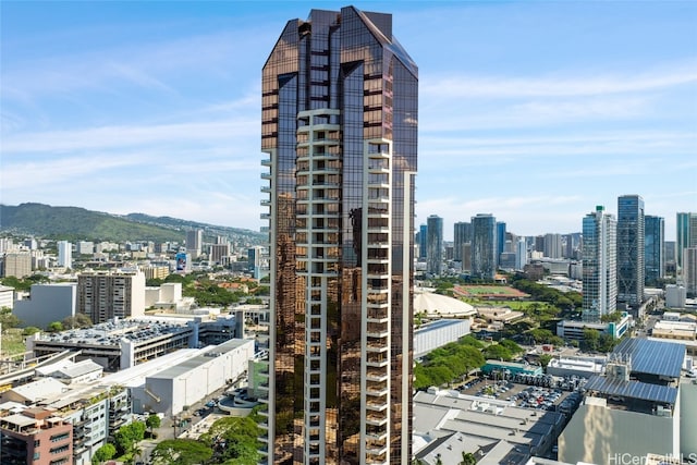 property's view of city with a mountain view