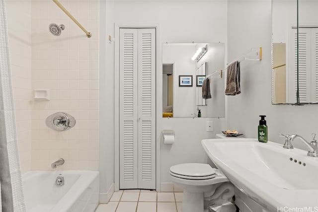 full bathroom featuring tile patterned floors, toilet, shower / bathtub combination with curtain, and sink