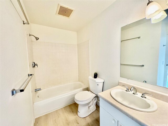 91-1101 Namahoe St Unit 3G, Kapolei, HI 96707 - full bathroom with wood finished floors, vanity, toilet, and tub / shower combination