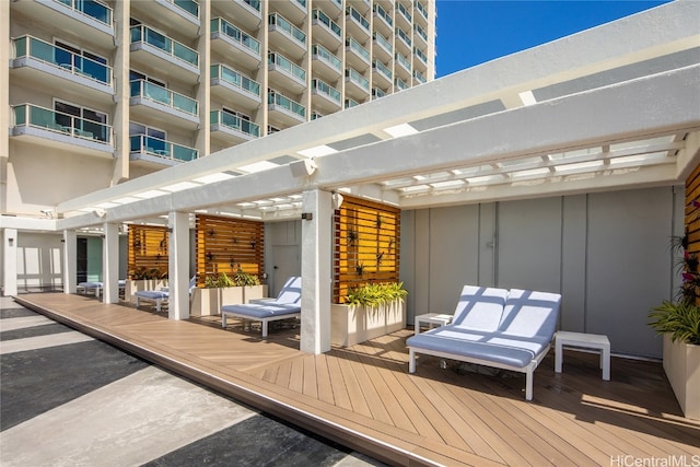 wooden deck featuring a pergola