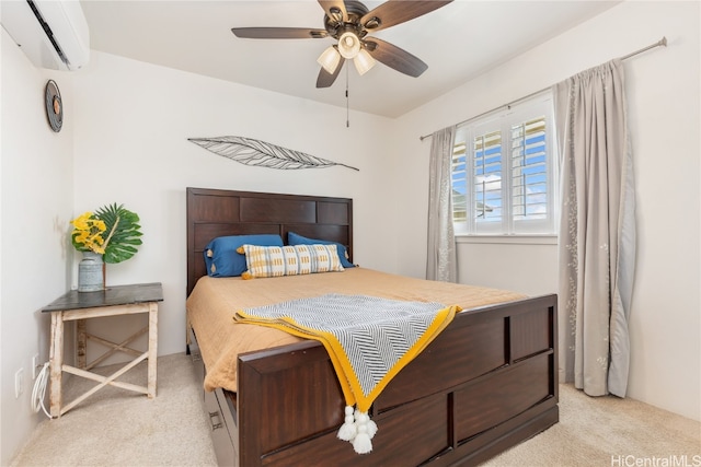 carpeted bedroom featuring a wall unit AC and ceiling fan