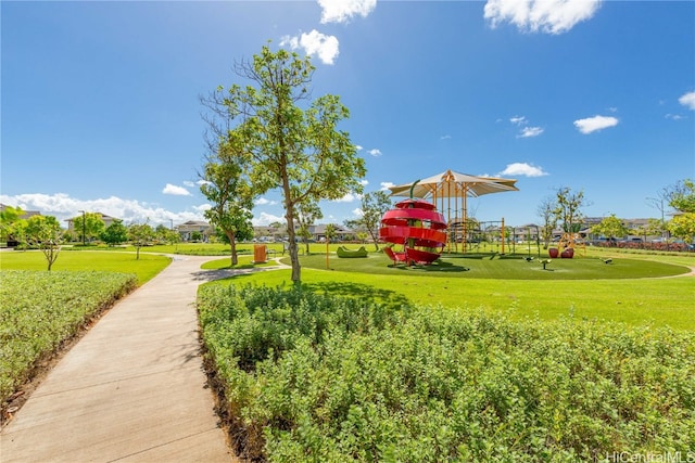 view of community featuring a lawn and a playground