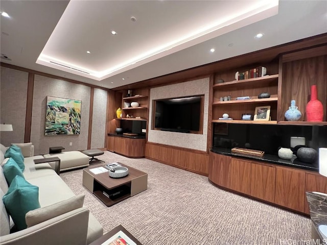 living room with light carpet and a tray ceiling