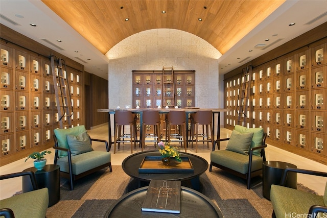 wine cellar featuring vaulted ceiling