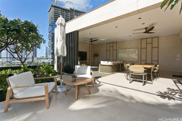 view of patio / terrace featuring ceiling fan