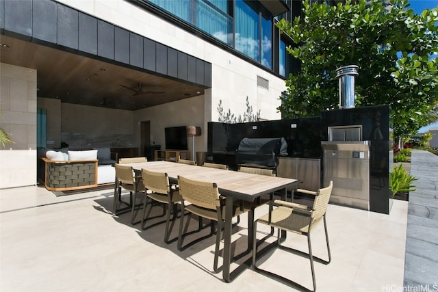 view of patio / terrace with area for grilling and ceiling fan