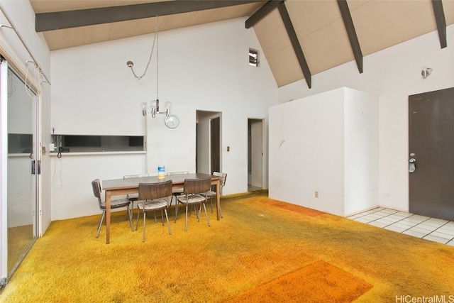 dining room featuring beamed ceiling, carpet floors, and high vaulted ceiling