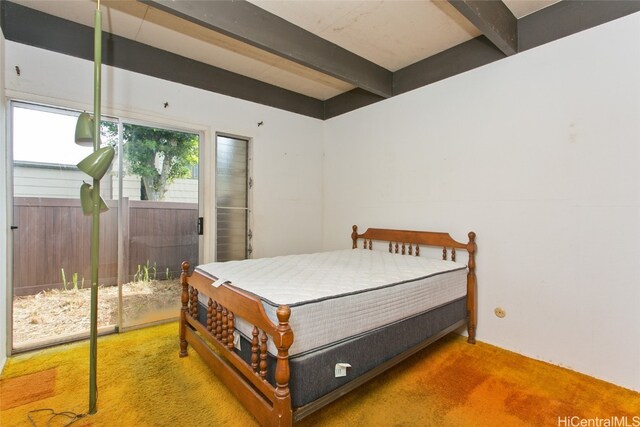 bedroom featuring beam ceiling and carpet floors