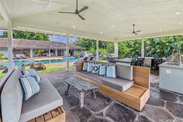 view of patio with outdoor lounge area and ceiling fan