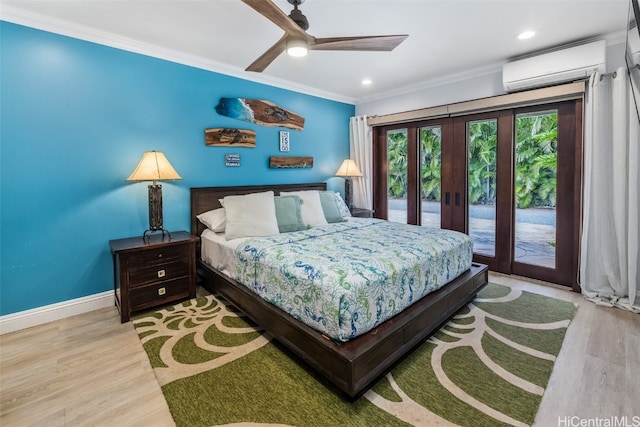 bedroom featuring a wall unit AC, ceiling fan, light hardwood / wood-style flooring, and access to outside