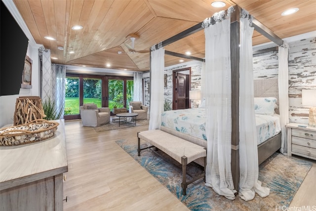 bedroom featuring light hardwood / wood-style flooring, lofted ceiling, and wood ceiling