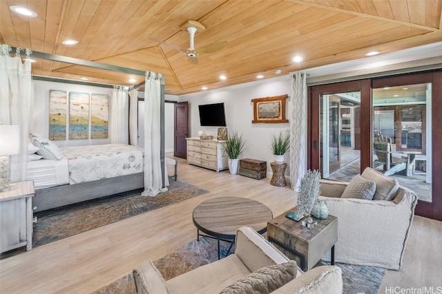 bedroom with light hardwood / wood-style flooring, wood ceiling, and lofted ceiling