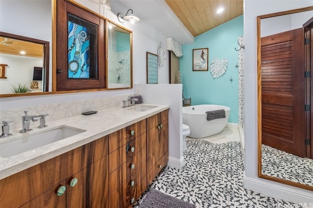 bathroom with tile patterned floors, a bathtub, vanity, and wooden ceiling