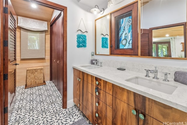 bathroom with tile patterned flooring and vanity