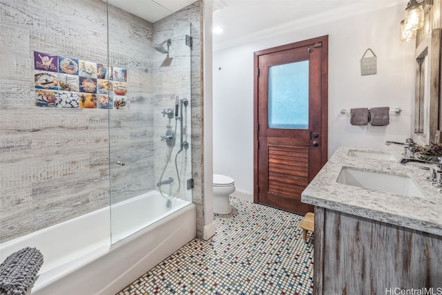 full bathroom featuring tile patterned flooring, vanity, tiled shower / bath combo, and toilet