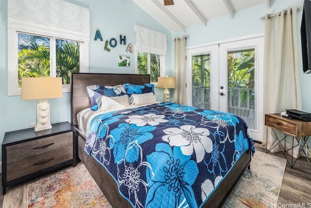 bedroom featuring hardwood / wood-style flooring, vaulted ceiling with beams, access to outside, and french doors