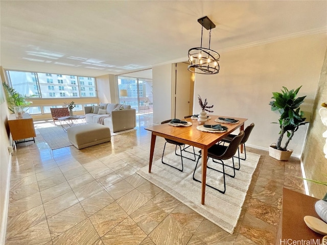 dining space featuring a chandelier and crown molding