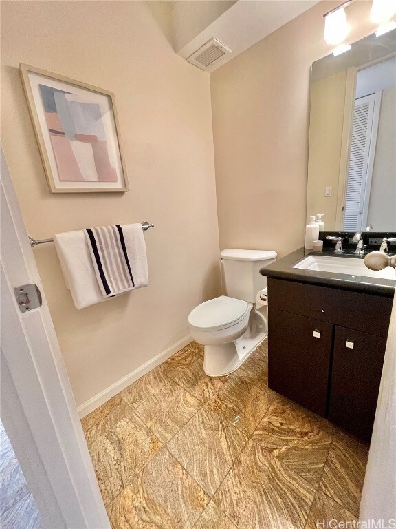 bathroom with vanity and toilet