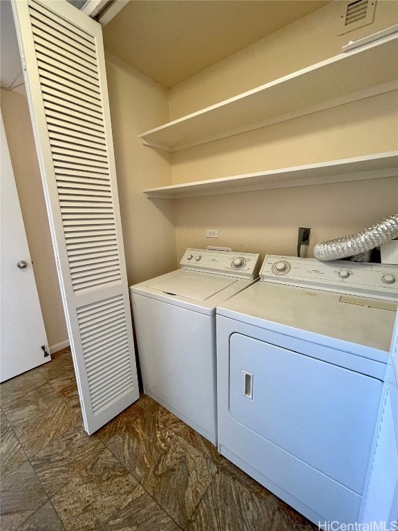 washroom featuring washer and dryer