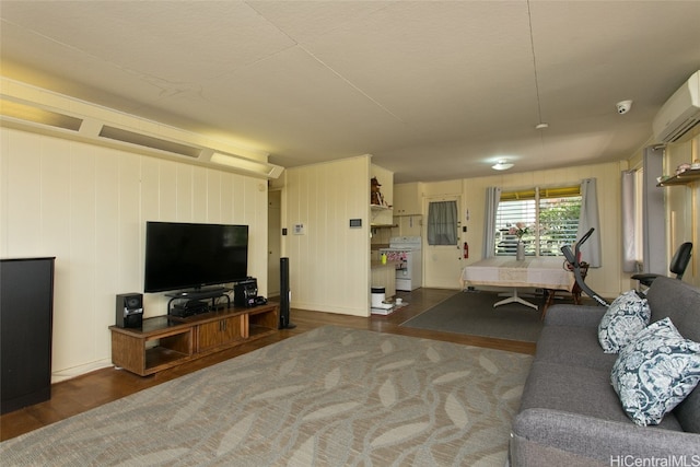 living room featuring wooden walls and dark wood-type flooring