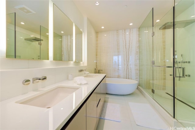 bathroom featuring tile patterned floors, vanity, and independent shower and bath