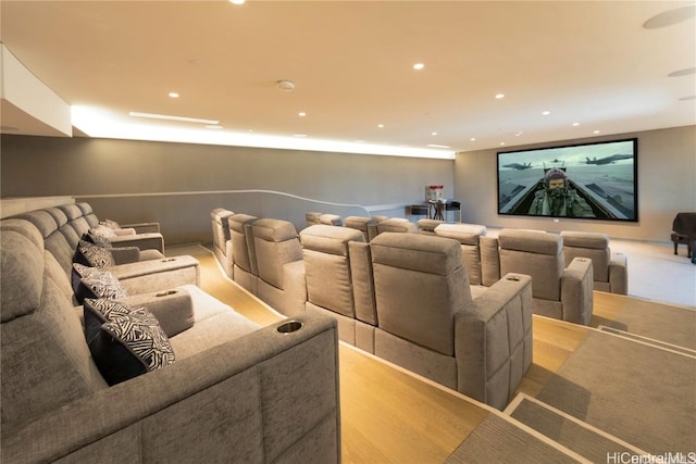 cinema room with light hardwood / wood-style flooring