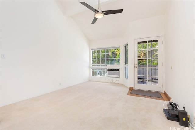 unfurnished living room with carpet floors, high vaulted ceiling, and ceiling fan