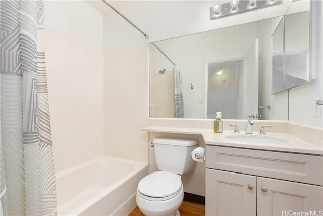 full bathroom featuring vanity, toilet, wood-type flooring, and shower / tub combo with curtain