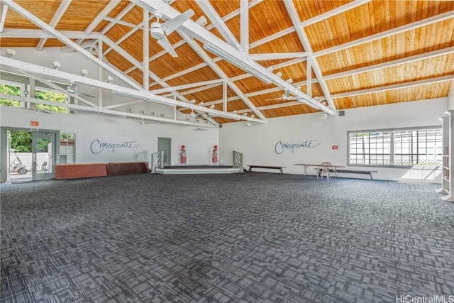 garage featuring ceiling fan and wooden ceiling