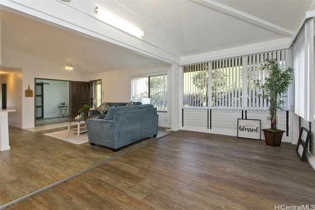 living room with beam ceiling, high vaulted ceiling, and dark wood-type flooring