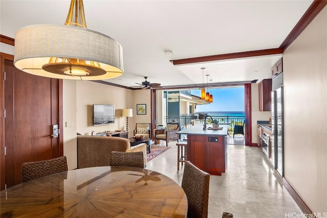 dining area with ceiling fan, a wall of windows, baseboards, and ornamental molding