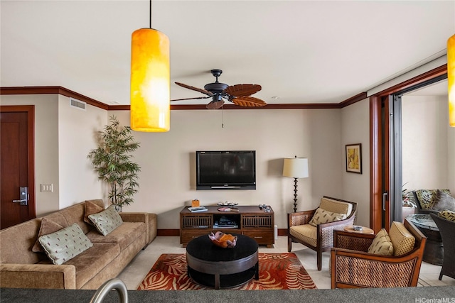 living room featuring visible vents, carpet floors, ceiling fan, and crown molding