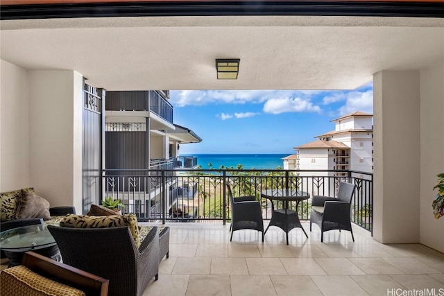 balcony featuring a water view