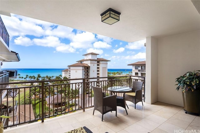 balcony featuring a water view