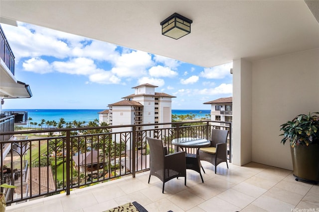 balcony featuring a water view