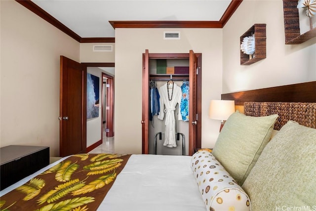 bedroom with crown molding, visible vents, and a closet