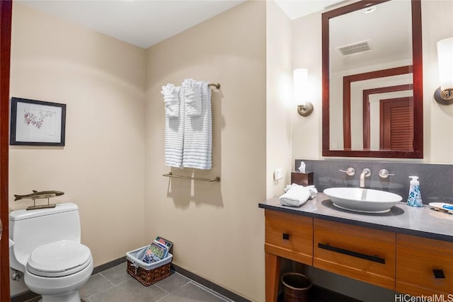 half bath with tile patterned floors, visible vents, toilet, decorative backsplash, and vanity