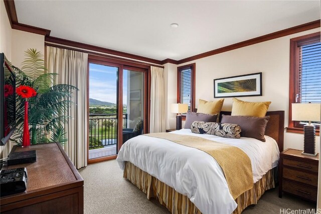 bedroom featuring light colored carpet, ornamental molding, and access to outside