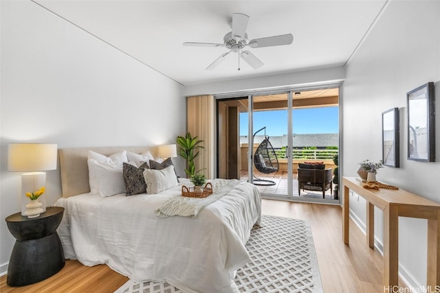 bedroom with ceiling fan, access to outside, and light hardwood / wood-style flooring