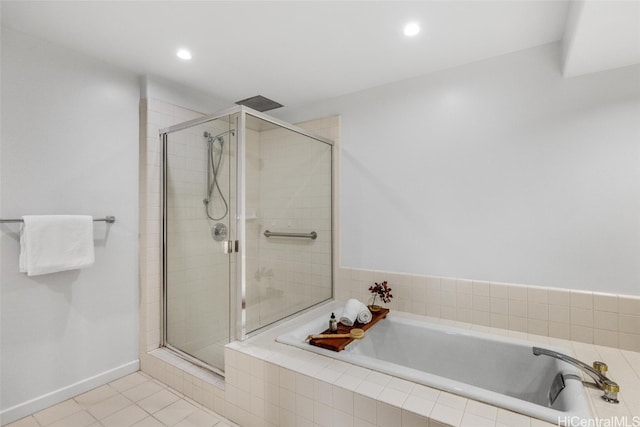 bathroom featuring tile patterned floors and shower with separate bathtub