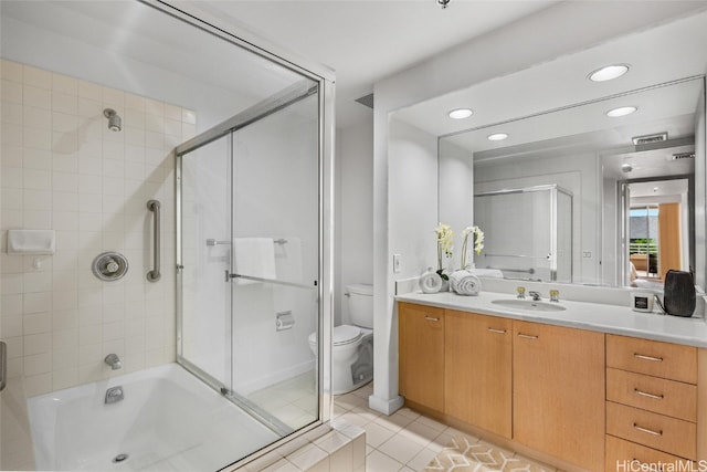 bathroom featuring tile patterned floors, vanity, and toilet