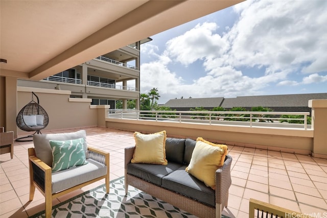 view of patio with outdoor lounge area and a balcony