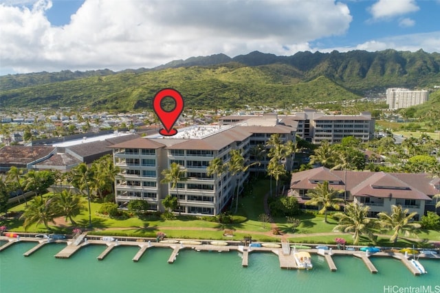 birds eye view of property featuring a water and mountain view