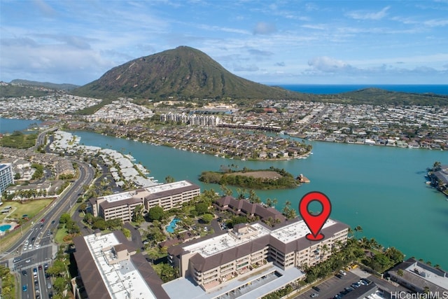 aerial view featuring a water and mountain view